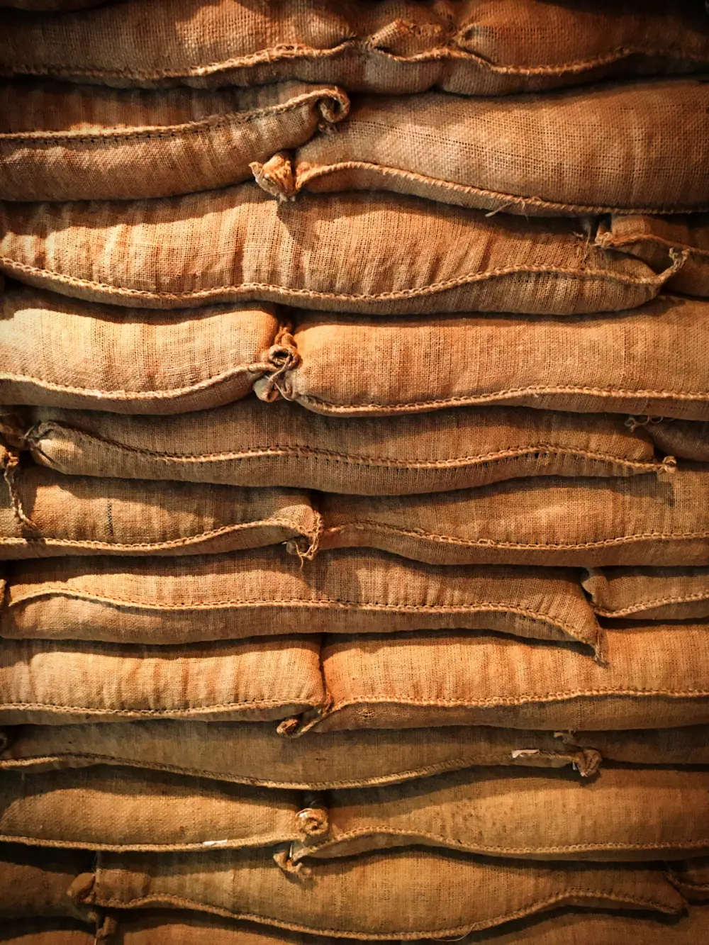 Stacked coffee sacks prepared for handling
